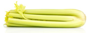Lying bunch of large celery stems with shadow and reflection on glossy surface isolated on white background