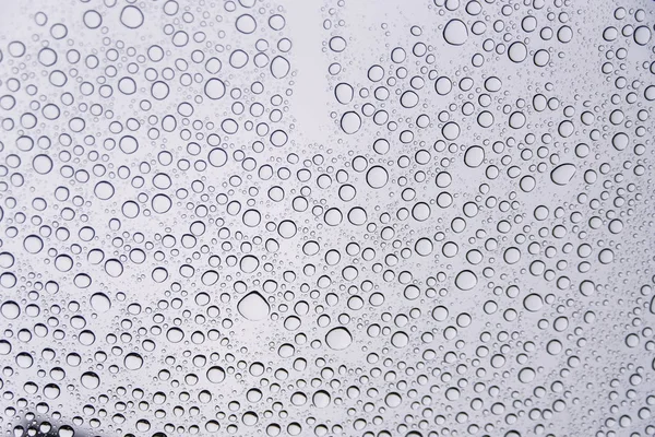 Superfície de vidro com muitas gotas de água. Contexto . — Fotografia de Stock