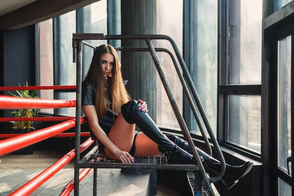 Attractive model wearing leather shorts and jacket posing on boxing ring. — Stock Photo, Image