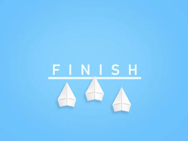 Three paper planes cross the finish line and one is ahead of the others.