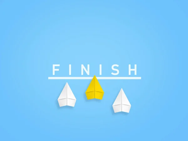 Three paper planes cross the finish line and the yellow one is ahead of the others.