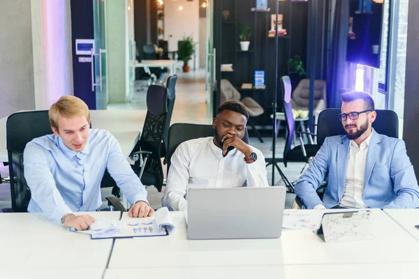 Tired depressed bored african businessman frustrated by business failure bankruptcy looking at laptop feel exhausted having headache, upset stressed black office worker worried about problem at work