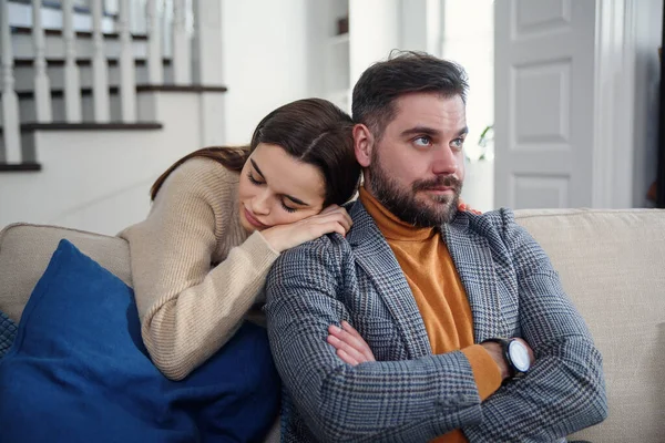 Attractive woman apologizing to frustrated man after quarrel, doubting boyfriend ignore, girlfriend feeling guilty, asking forgive her, begging pardon, admits mistake, regret, couple having problem — Stock Photo, Image