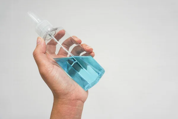 Alcohol bottle for hygiene in hand — Stock Photo, Image