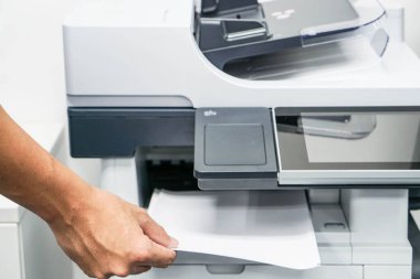 Printing and scaning a document by a businessman clipart