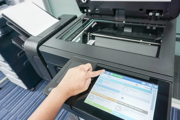 Businesswoman with printer touchscreen for scanning — Stock Photo, Image