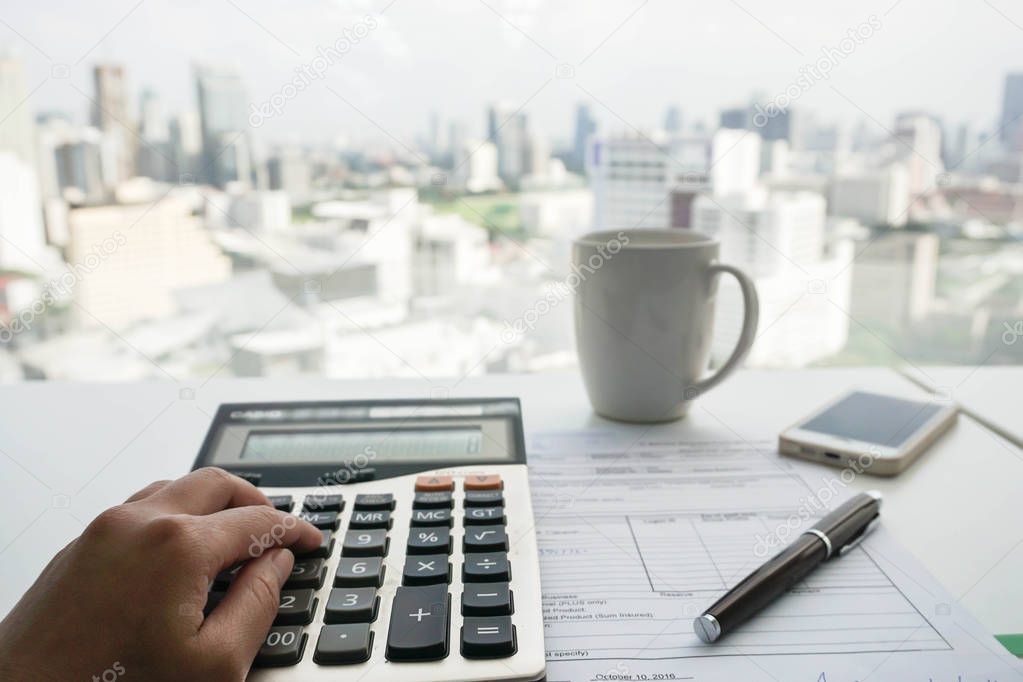 accountant with calculator for tax and salary calculation
