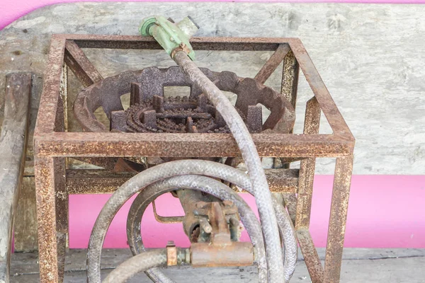 Close up old and rusty gas stove with supply gas pipes — Stock Photo, Image