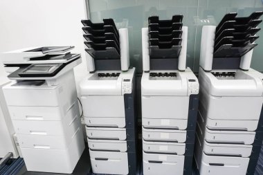four printer machines in office ready for business documents clipart