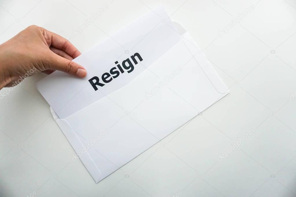 business concept of isolated woman hold resignation letter in left hand