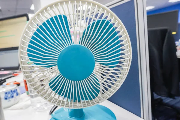 Close up portable blue table fan in office — Stock Photo, Image