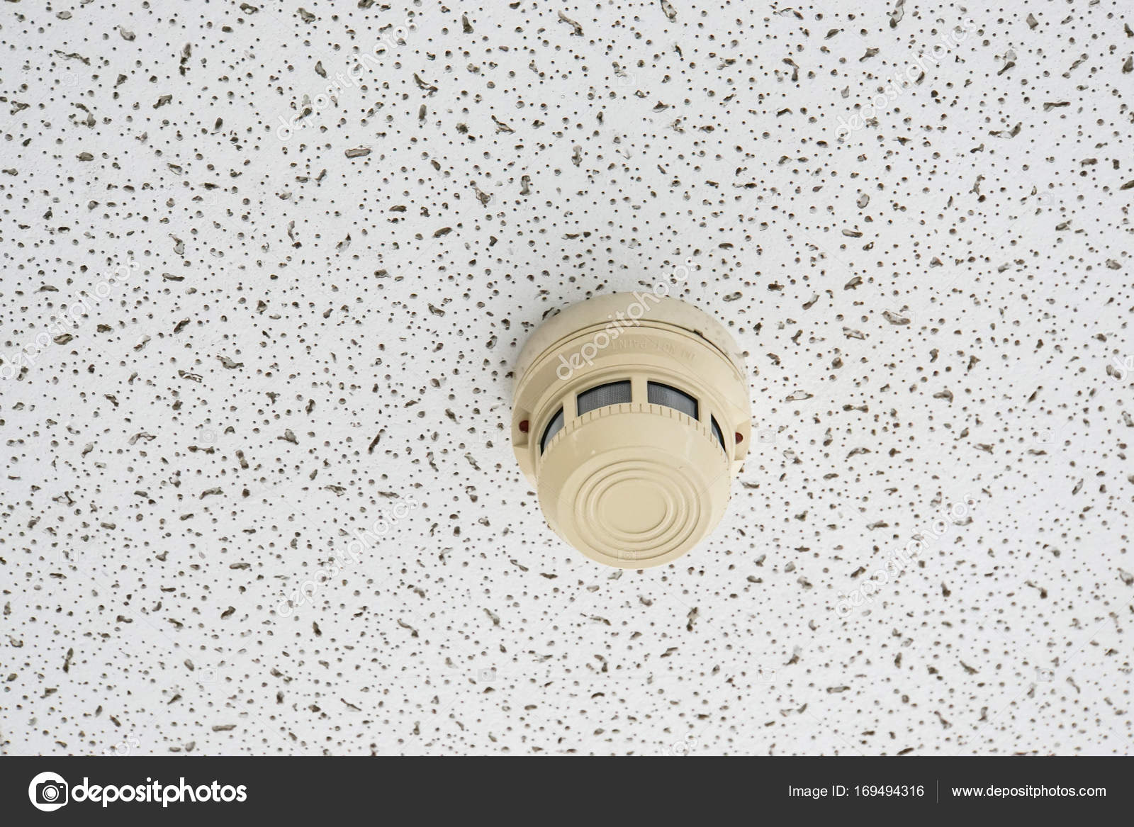 Smoke Alarm Detector On The Ceiling For Building Safety Stock