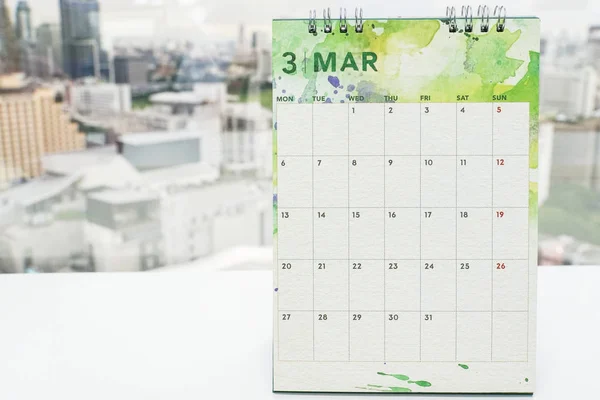 mock up calendar of March on office desk for meeting and appointment reminder