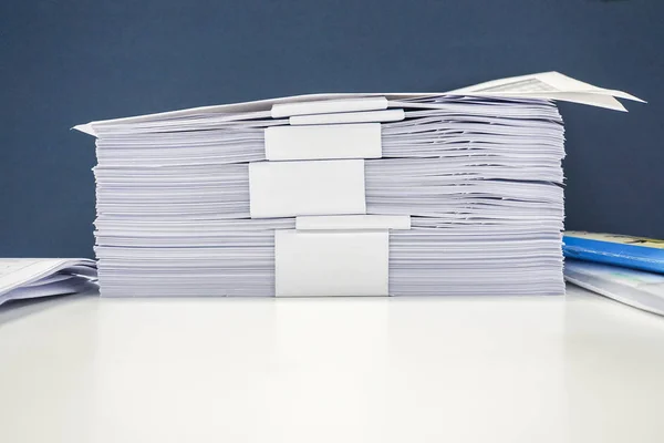 neat A4 documents pile on office desk