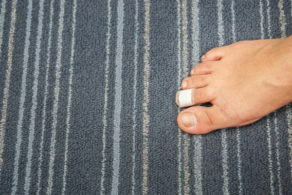 wound at woman toe right foot healed with band aid for medical care