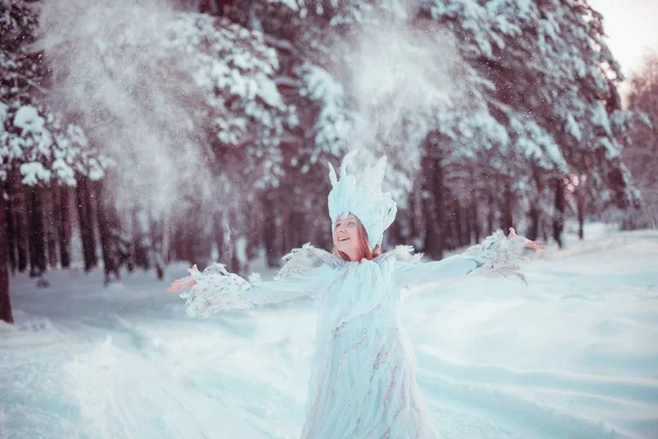 The image of the Snow Queen. Girl in winter forest. Snow, winter, Blizzard, forest, girl in the way of winter.