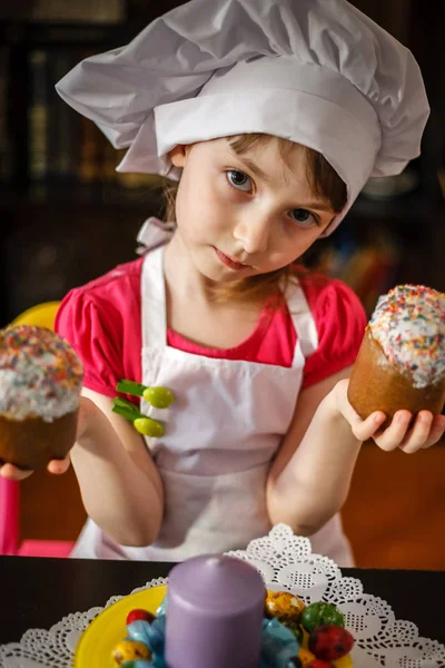 Spring has come. Easter Eve. Easter eggs. Easter eggs. A girl in a cook suit. Paint eggs. The oven of the cake. Welcome spring.