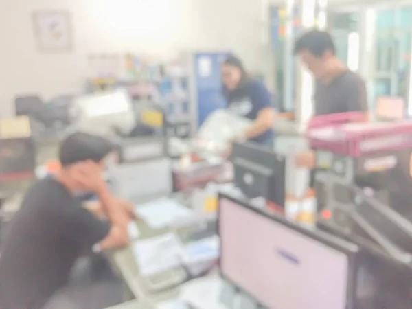 Blurred image of counter service at hotel for background usage.Blur abstract background hall customer or cashier desk indoor space in office bank interior:staff working.lab