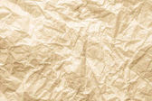 Přírodní recyklovaný papír Texture.Natural dekorativní recyklované umění dopis texturu papíru, lehké hrubý texturou pozadí prostoru strakaté prázdná kopie v béžové, žluté a hnědé .