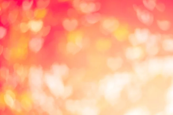 Verschwommener Hintergrund des Valentinstags-Konzepts. verschwommen städtischen Ort Sonnenuntergang / Sonnenaufgang Stunde glühen Bokeh-Glanz . — Stockfoto