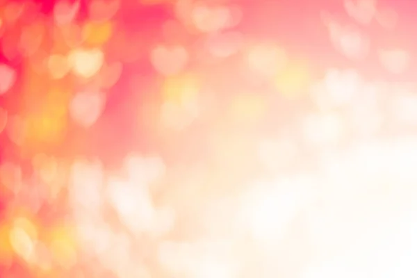 Verschwommener Hintergrund des Valentinstags-Konzepts. verschwommen städtischen Ort Sonnenuntergang / Sonnenaufgang Stunde glühen Bokeh-Glanz . — Stockfoto