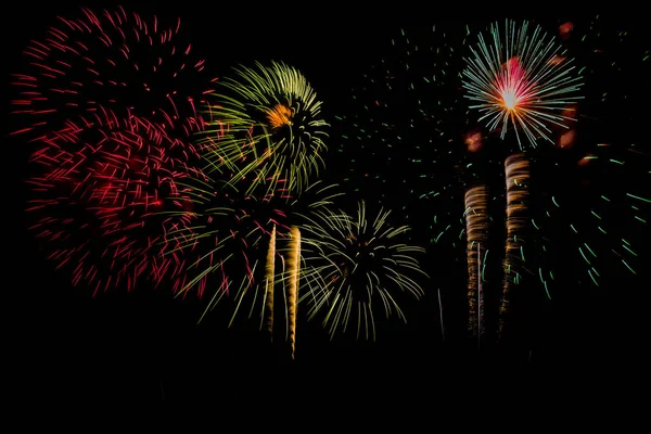 Fireworks Celebration at night on  New Year and copy space .Multicolor Firework Celebration over the soft focus on background . — Stock Photo, Image