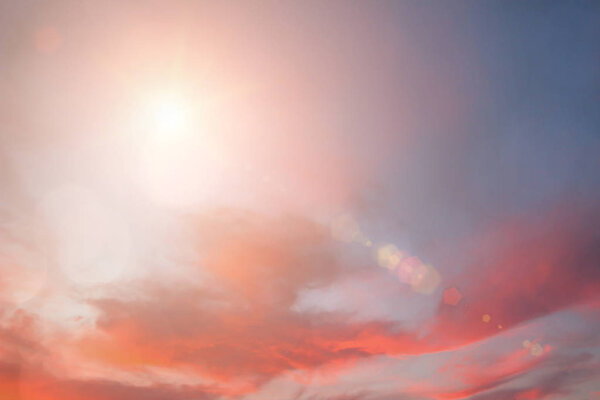 Pastel natural abstract blurred sky background create light soft colors and bright sunshine a short time before sunset.