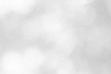 Soyut beyaz bokeh, arka planda bulanıklık olan, klasik tarzda bulanık ışık partisi, sıcak ışıltı ve soluk renkli, dairesel, sönük modern. Tatil için gri, parlak fotokopi alanı.