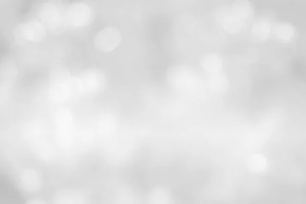 Cinza e branco natureza borrada cor brilho colorido luz espumante verão. O conceito turvo do Dia dos Namorados. Textura bokeh branco abstrato com bolha foreground macio brilhante em estilo vintage cinza brilhante . — Fotografia de Stock