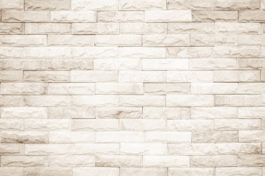 Geniş krem tuğla duvar dokusunun arka planı. Eski kahverengi tuğla duvar beton ya da taş duvar dokusu, duvar kağıdı kireç taşı soyut döşeme / Sistem düzensiz iç kaya. Ev veya ofis tasarımı arkaplanı.