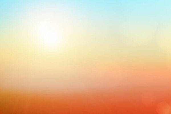 Natural background blurring warm colors and bright sunlight. Bokeh or Christmas background blue sun at sky sunny color orange light patterns plain abstract flare evening clouds blur. Heavenly mind view at a resort deck touching