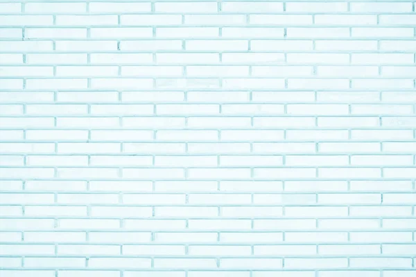 Pastel Blue and White brick wall texture background. Brickwork painted of blue color interior rock old pattern clean concrete grid uneven brick design stack. Home or office design backdrop decoration.