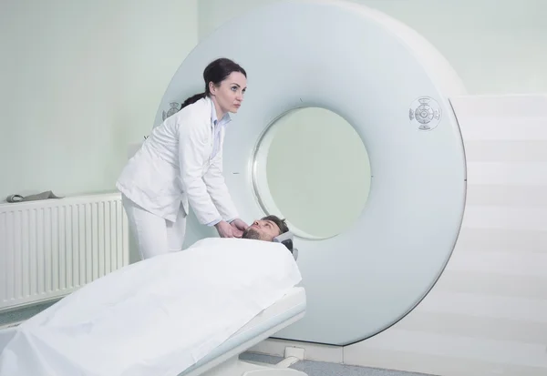 Patient being scanned and diagnosed on CT scanner — ストック写真