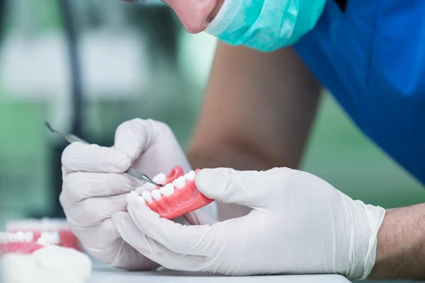 Dental prosthesis working on the denture — Stock Photo, Image