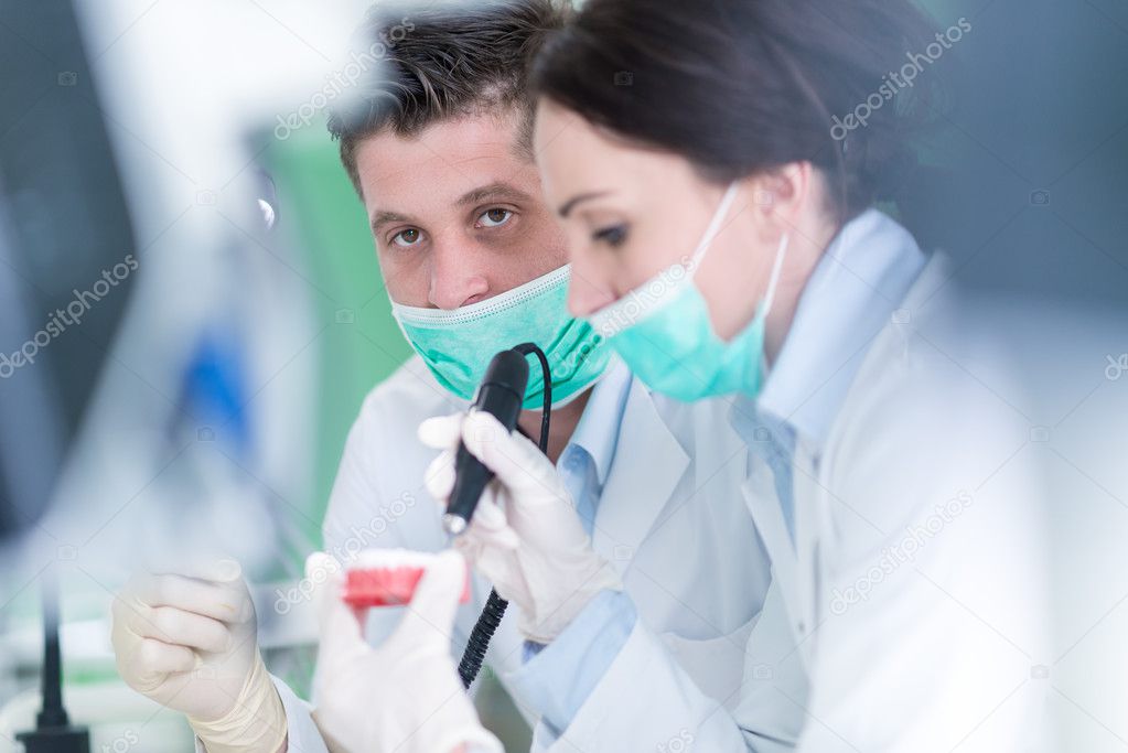 Dental students while working on the denture