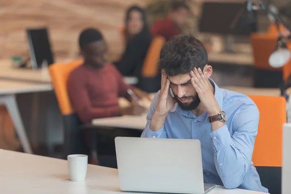 Software Developer sitting with laptop — Φωτογραφία Αρχείου