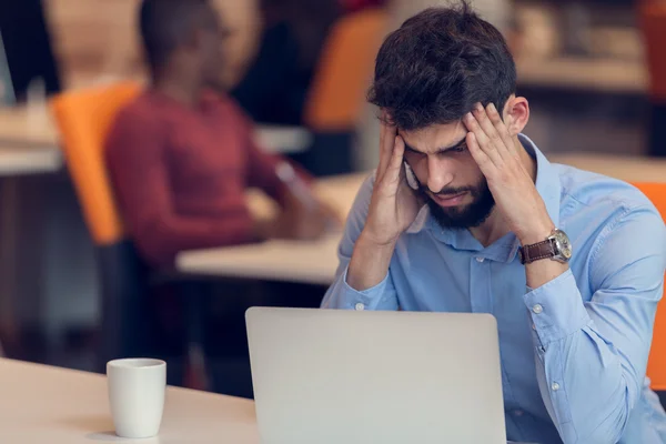 Software Developer sitting with laptop — ストック写真