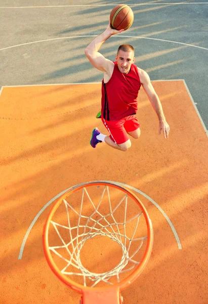 View of flying ball to basket from top. Face gesture. — Stockfoto