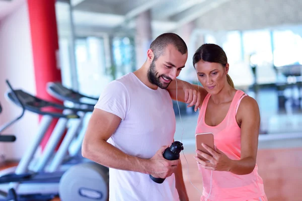 Couple taking a sefie in a gym Stock Picture
