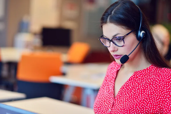 Young woman working in call centre — Stock Photo, Image