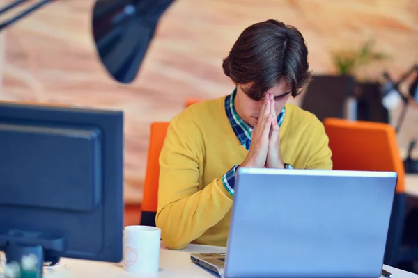 Man working in office in front on computer — Stock Photo, Image