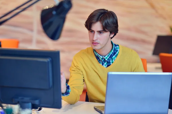 Man working in office in front on computer — Stock Photo, Image