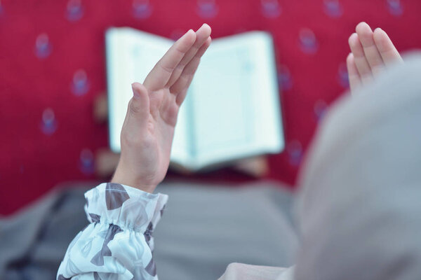 muslim woman praying in mosque