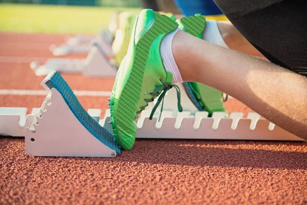 Feet on starting block ready for a spring start. — Stock Photo, Image