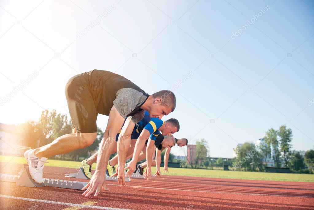 People ready to race on track field