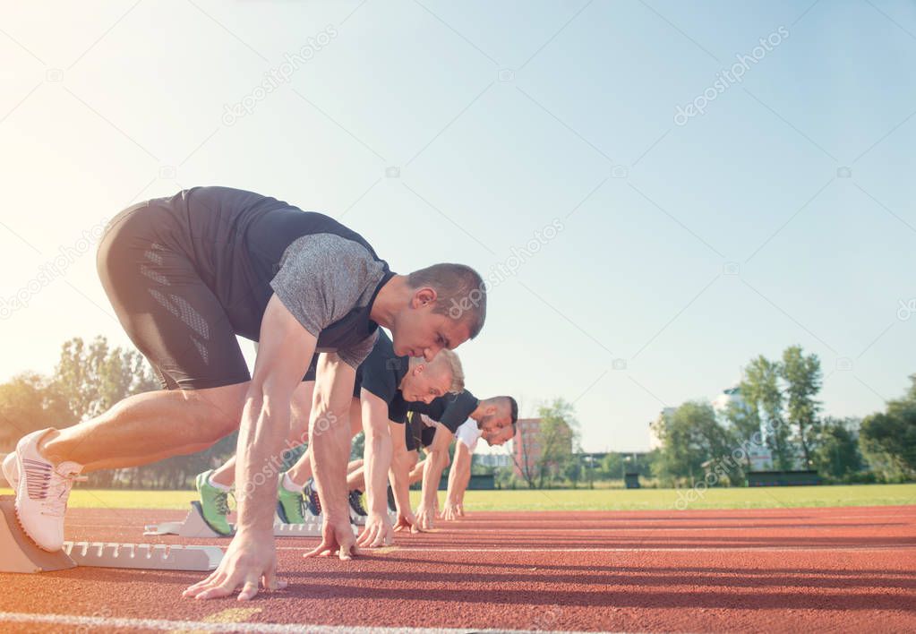 People ready to race on track field