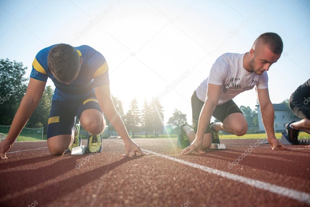 People ready to race on track field