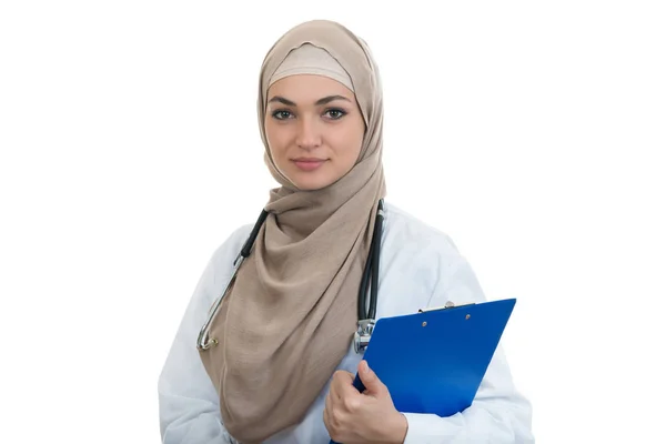 Confident muslim female doctor holding folder. Royalty Free Stock Photos