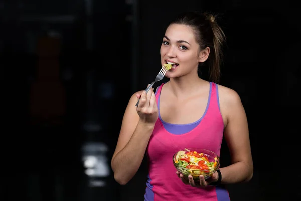 healthy young woman with salad
