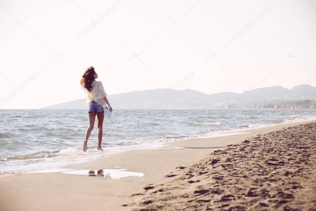 Young female enjoying day on beach